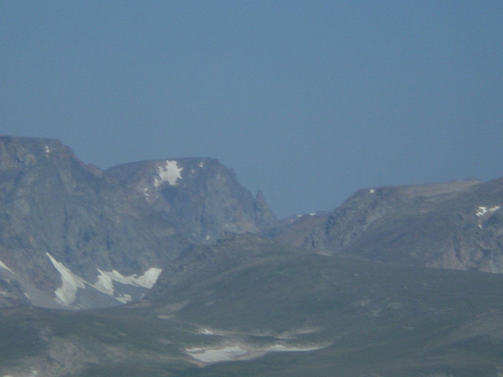 The bear's tooth sticks up amidst the other mountains.