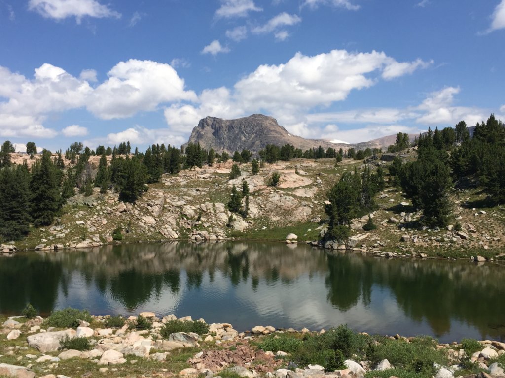 Lonesome Mountain stands above an alpine lake